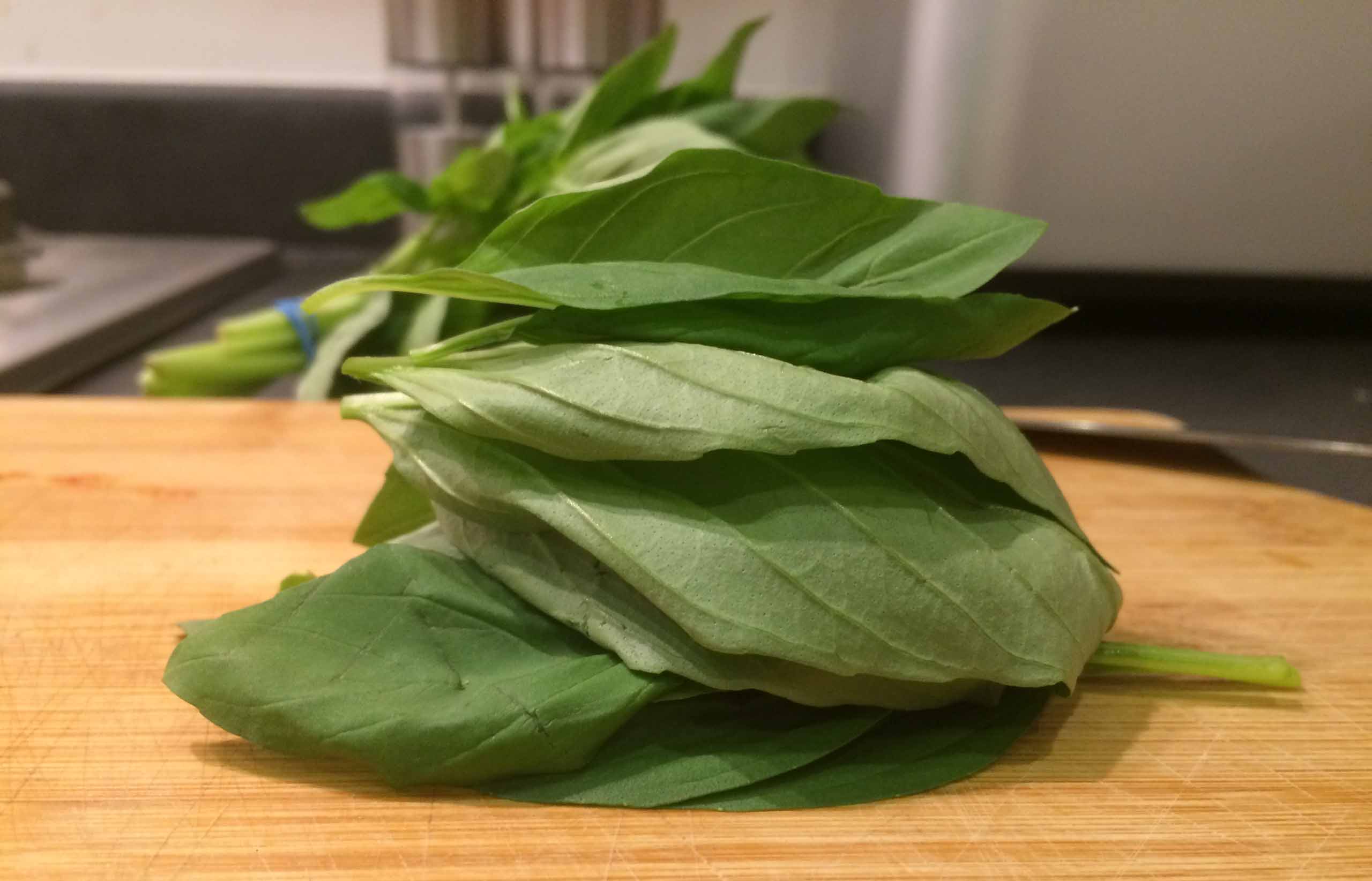 A pile of Basil on a chopping block