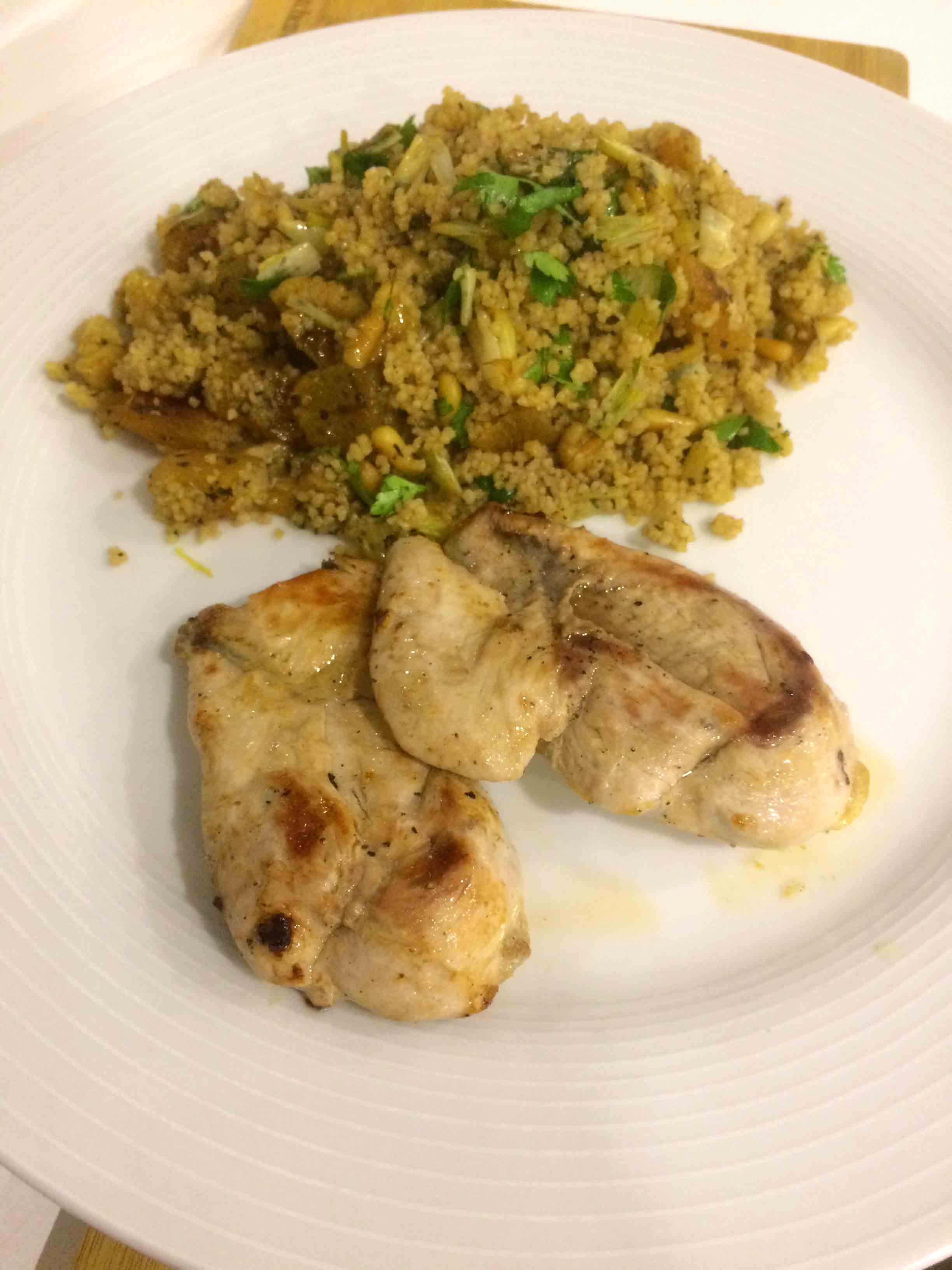 couscous salad with partridge served on a plate.