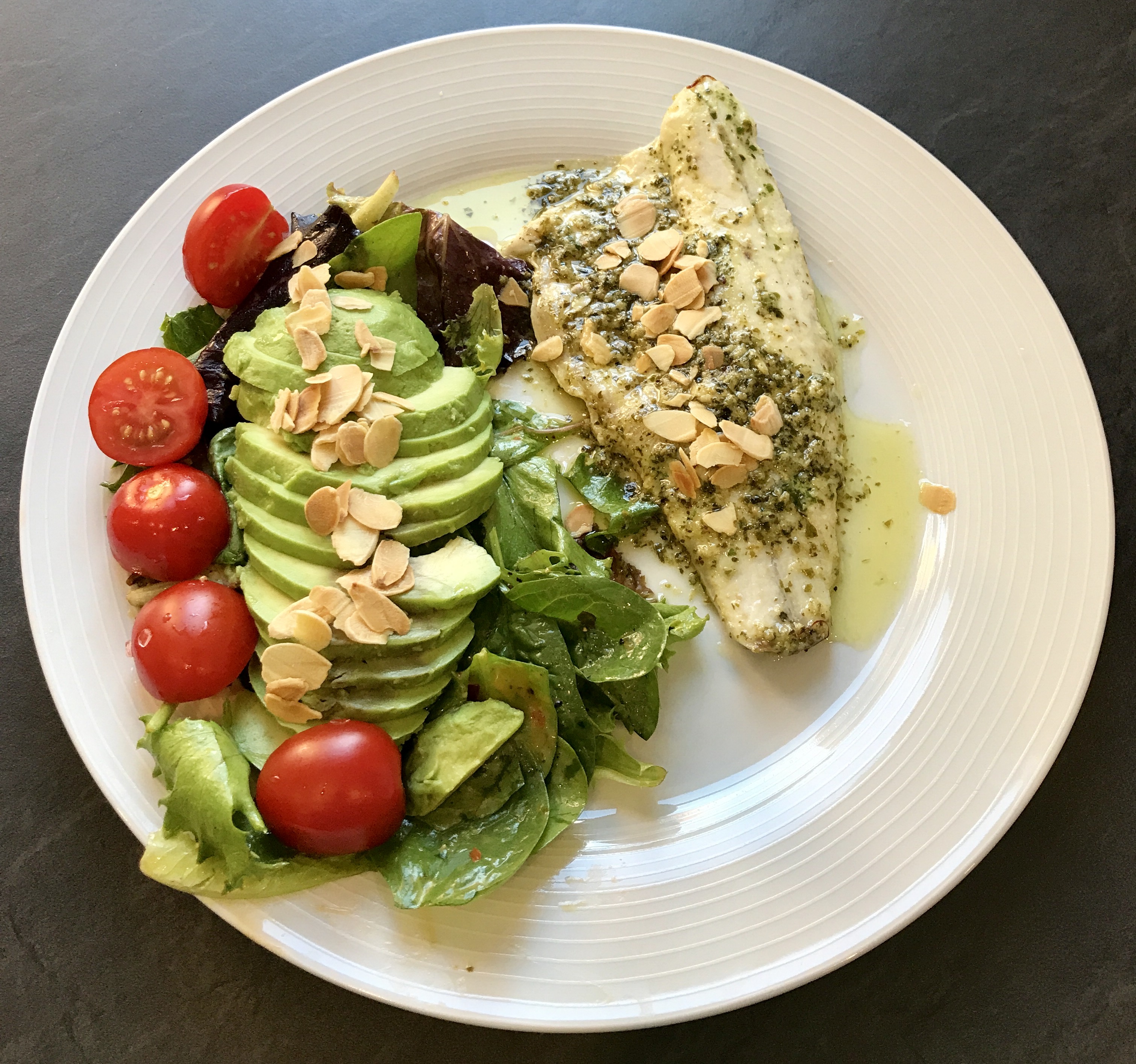 Pesto sea bass and almonds with a tropical salad